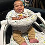 Damon joined the competition — help win amazing prizes! baby, smiling, baby_seat, cushion, infant, clothing, pants, foot, happy, indoor, person, child, face, seat, fabric, pattern, home, cute, relaxed, joyful