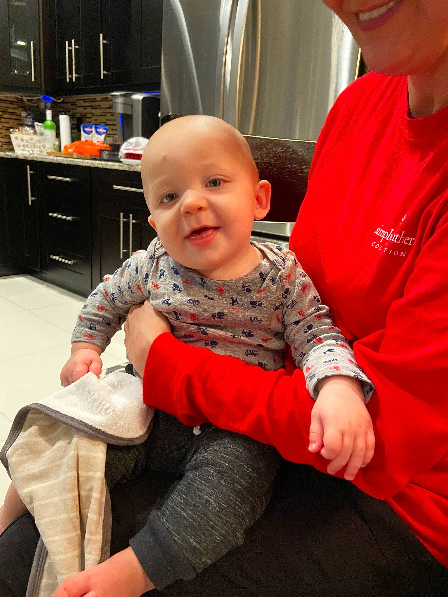 Brett joined the competition — help win amazing prizes! arm, baby, cheek, child, lap, leg, person, sitting, skin, toddler