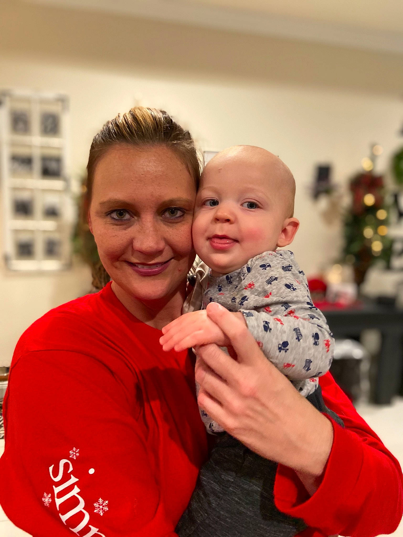 Brett is registered to the contest to win money with this photo: child, daughter, father, happy, holiday, hug, joy, person, red, smile, toddler