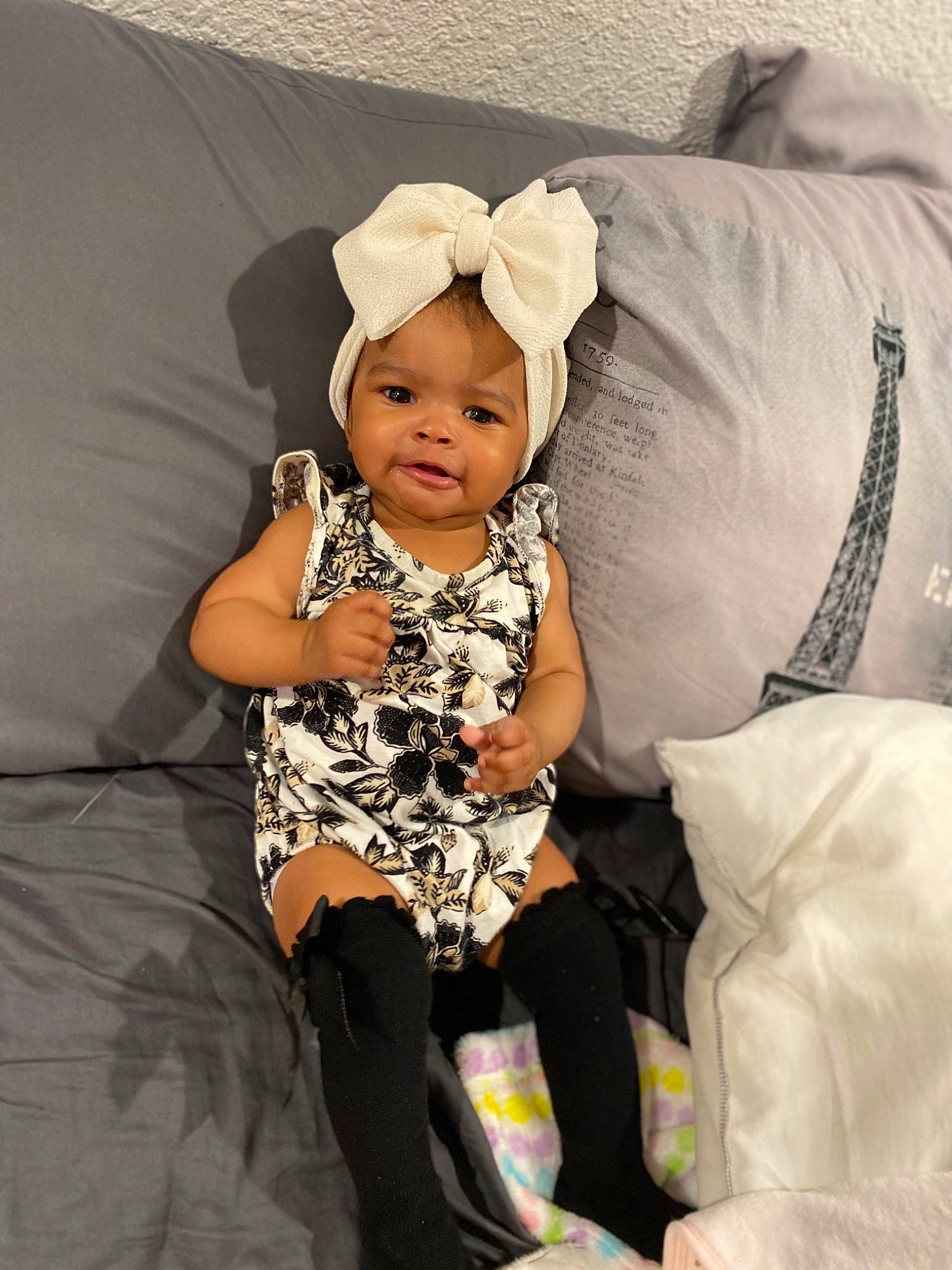 Gloria joined the competition — help win amazing prizes! baby, baby_products, baby_sleeping, baby_toddler_clothing, child, comfort, costume_hat, couch, event, fashion_accessory, gesture, happy, headwear, lap, linens, pattern, person, sitting, sleeve, smile