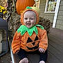 baby, pumpkin_costume, child, smiling, fall, autumn, halloween, porch, hay_bale, pumpkin, decorations, costume, cute, outdoor, seasonal, holiday, window, house, foot, happy