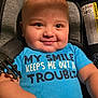 baby, smile, blue_onesie, car_seat, child, infant, happy, cute, drool, face, eyes, skin, hand, clothing, seatbelt, warning_label, indoor, portrait, person, cheeks