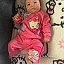 Saraiyah joined the competition — help win amazing prizes! baby, infant, child, pink_clothing, hello_kitty, blanket, patterned_blanket, cute, lying_down, indoors, portrait, face, chubby_cheeks, casual_wear, cartoon_character, soft_texture, comfortable, young_child, playful, resting
