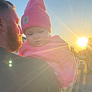 Saraiyah joined the competition — help win amazing prizes! baby, man, sunlight, sunset, pink_hat, outdoor, face, portrait, warm_light, lens_flare, beard, clothing, holding, person, sky, nature, casual, hat, child, daylight