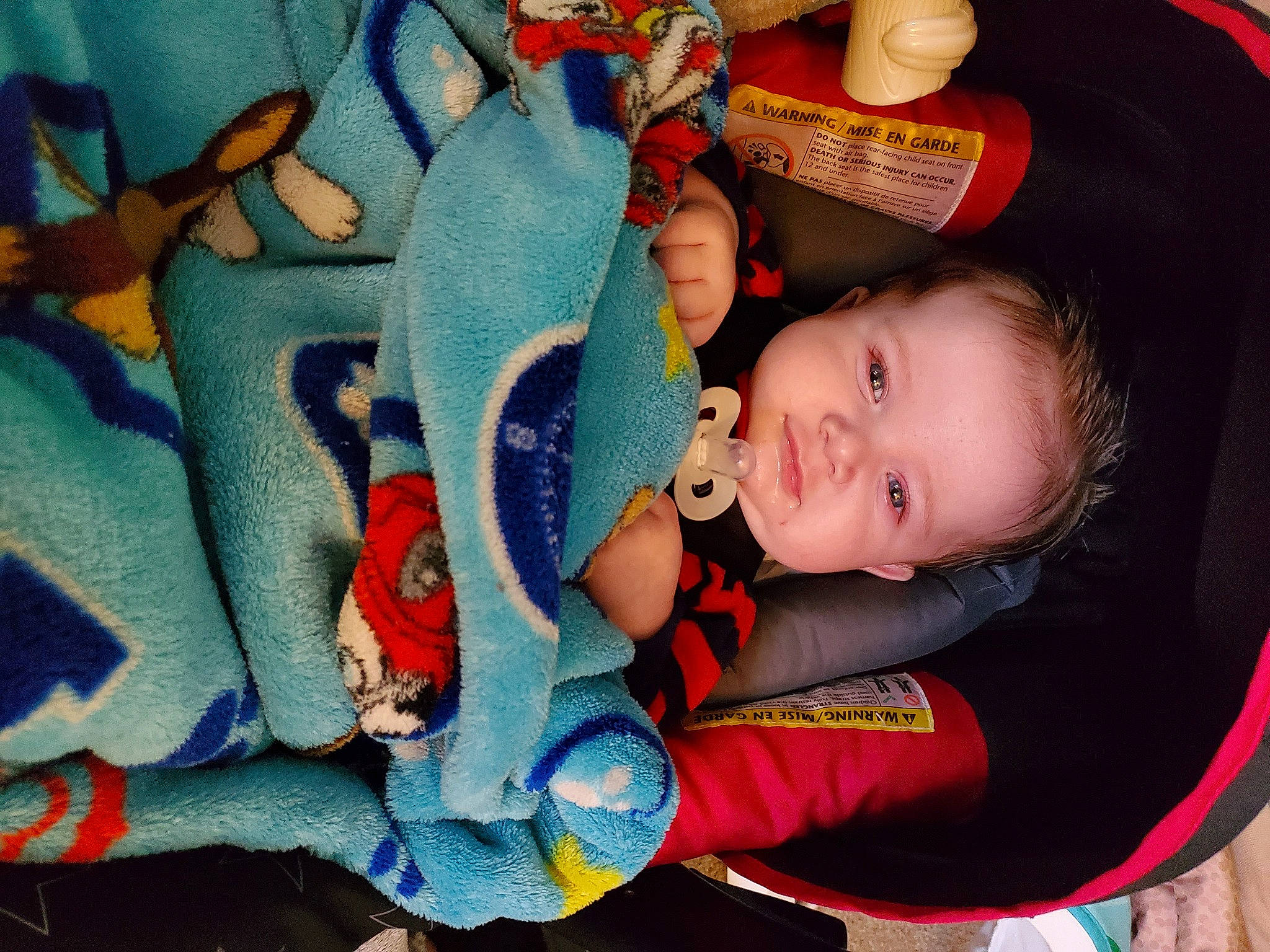 Dakota joined the competition — help win amazing prizes! arm, baby, baby_carriage, baby_products, baby_toddler_clothing, cheek, comfort, electric_blue, eye, fun, happy, head, iris, lap, mouth, orange, person, product, skin, textile