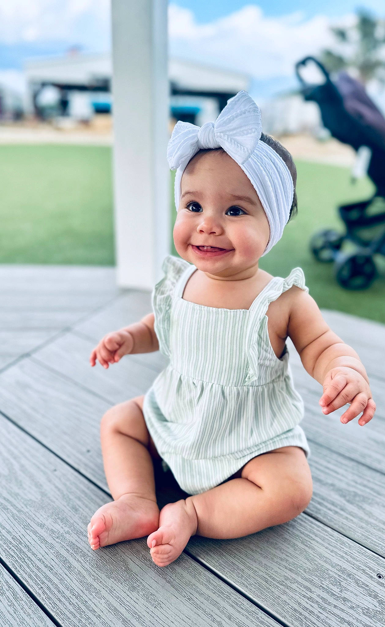Kalina is registered to the contest to win money with this photo: baby, baby_toddler_clothing, cap, child, day_dress, face, fashion_accessory, flooring, foot, fun, grass, happy, headwear, human_leg, joy, leisure, pattern, person, skin, sleeve