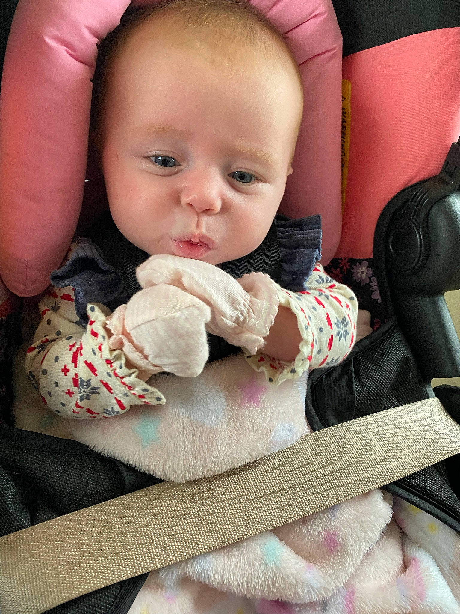 Bella is registered to the contest to win money with this photo: arm, baby, baby_in_car_seat, baby_sleeping, baby_toddler_clothing, cheek, child, comfort, eye, face, finger, hand, headgear, linens, lip, nail, nose, person, skin, textile