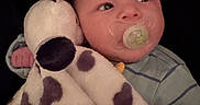 Remington is registered to the contest to win money with this photo: baby, bedtime, blanket, blue_pajamas, cheek, close_up, comfort_object, cuddle, cute, dark_background, hand, infant, newborn, nursery_item, pacifier, plush, polka_dots, portrait, soft_toy, stuffed_animal
