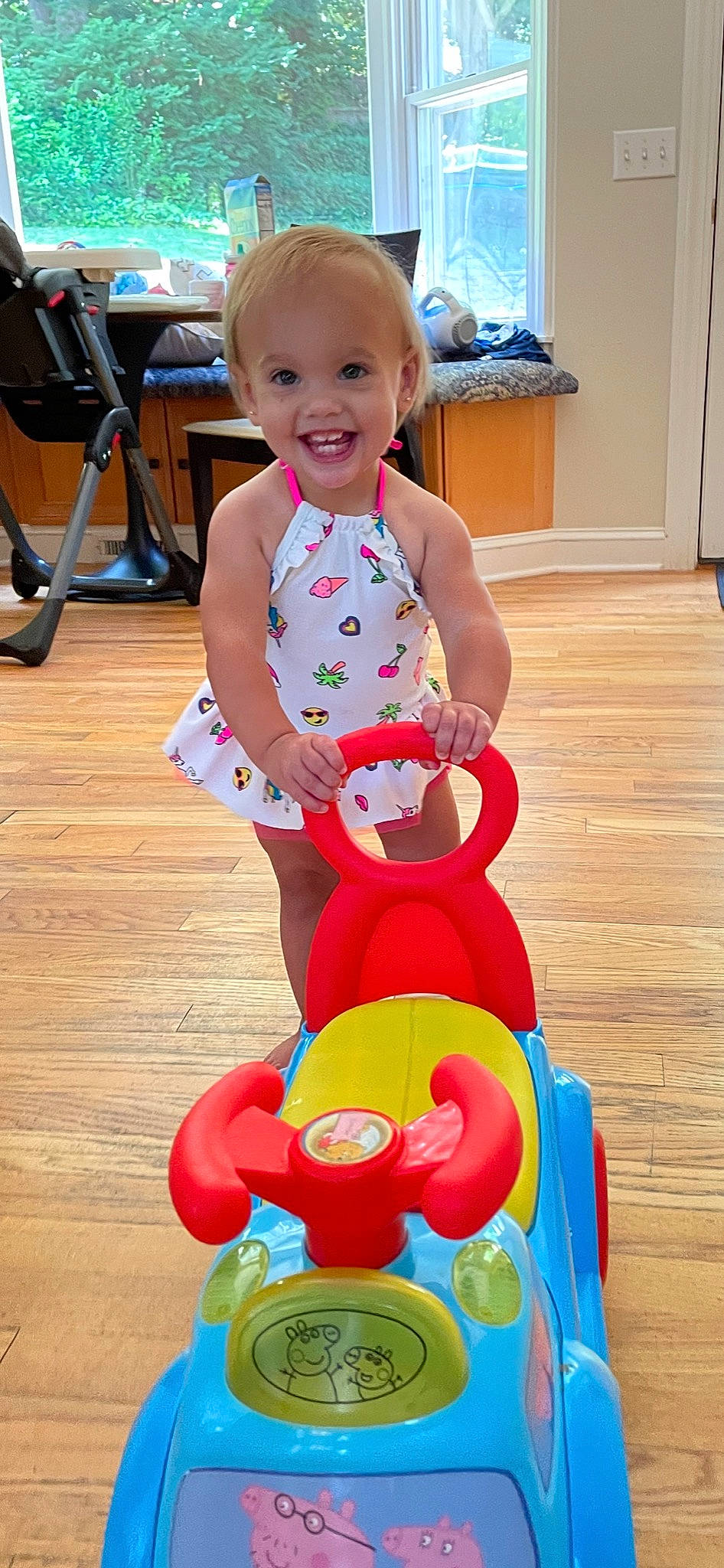 Ryder is registered to the contest to win money with this photo: baby, baby_playing_with_toys, baby_products, baby_toddler_clothing, blue, child, flooring, fun, happy, joy, leisure, person, photograph, recreation, riding_toy, sitting, skin, smile, snapshot, tire
