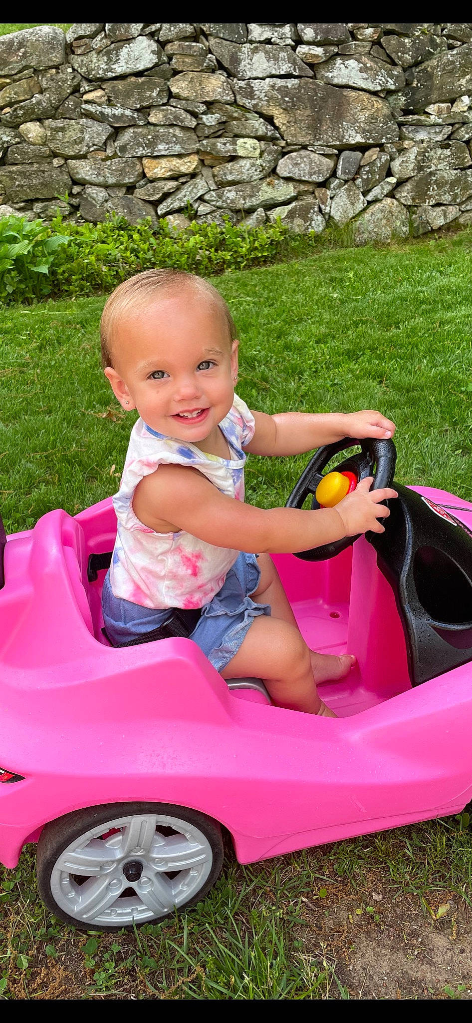 Ryder joined the competition — help win amazing prizes! automotive_design, automotive_exterior, baby_toddler_clothing, fun, grass, happy, joy, leisure, mode_of_transport, motor_vehicle, people_in_nature, person, photograph, pink, product, red, riding_toy, smile, tire, toy