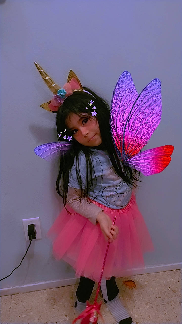 Itzel Abigail joined the competition — help win amazing prizes! costume, costume_hat, fashion_accessory, fashion_design, feather, fictional_character, fun, fur, glove, happy, headpiece, human_leg, magenta, mythical_creature, person, petal, pink, pollinator, purple, violet