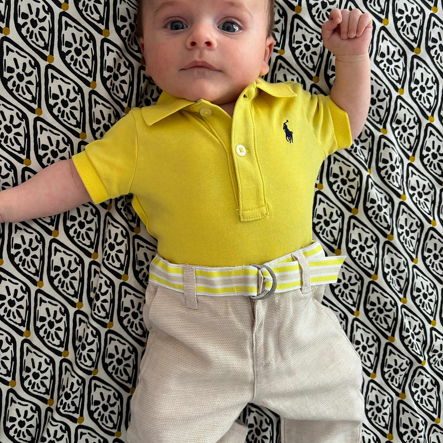 Milio participe au concours pour gagner de l'argent avec cette photo : accessories, baby, belt, blouse, bodypart, clothing, face, finger, hand, head, homedecor, linen, pants, pattern, person, photography, portrait, shirt, shorts, sleeve