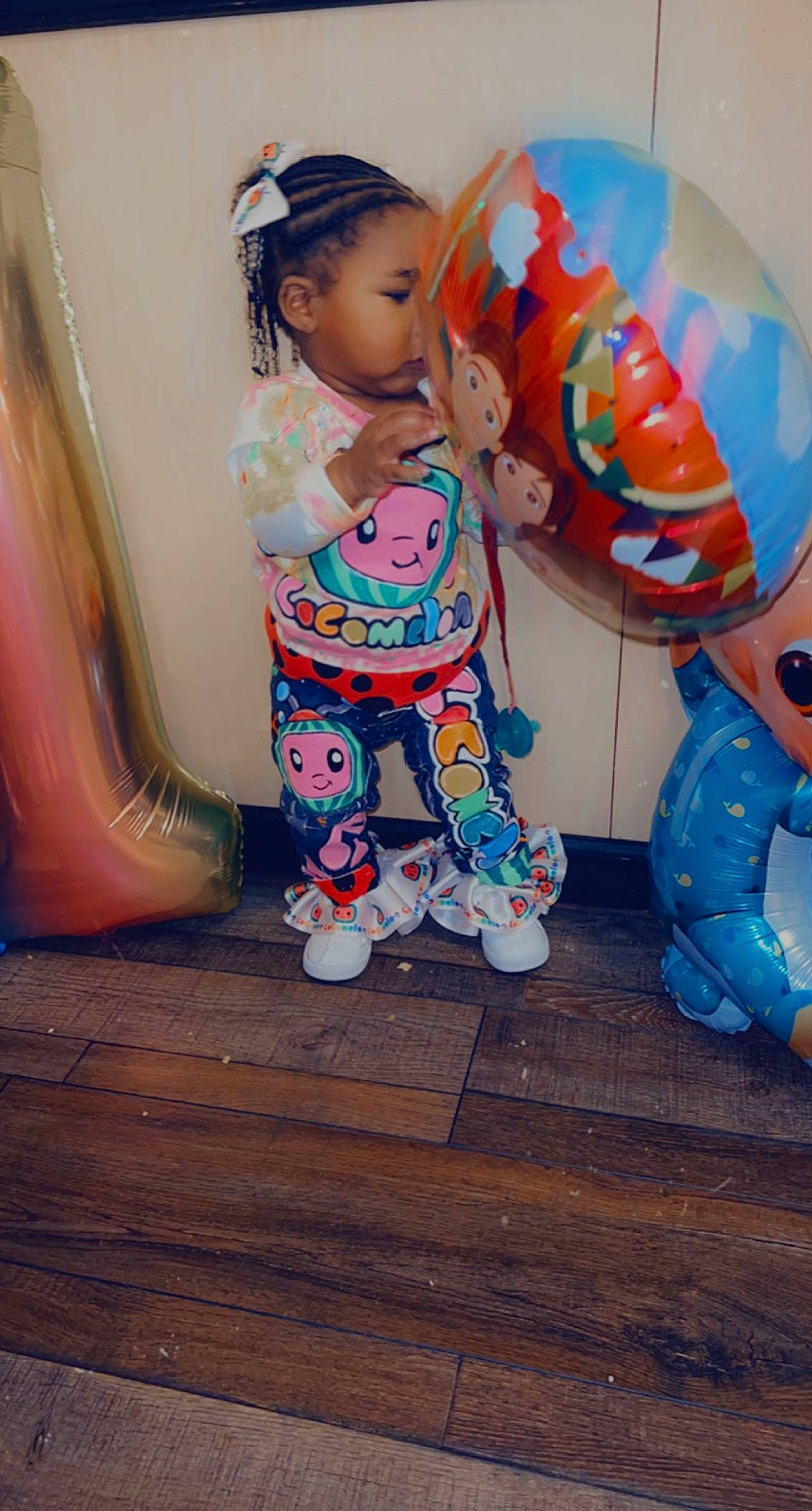 Taelynn joined the competition — help win amazing prizes! baby_toddler_clothing, balloon, child, doll, eye, face, flooring, hair, hardwood, head, leg, pattern, peach, person, pink, sleeve, sock, t_shirt, toddler, toy