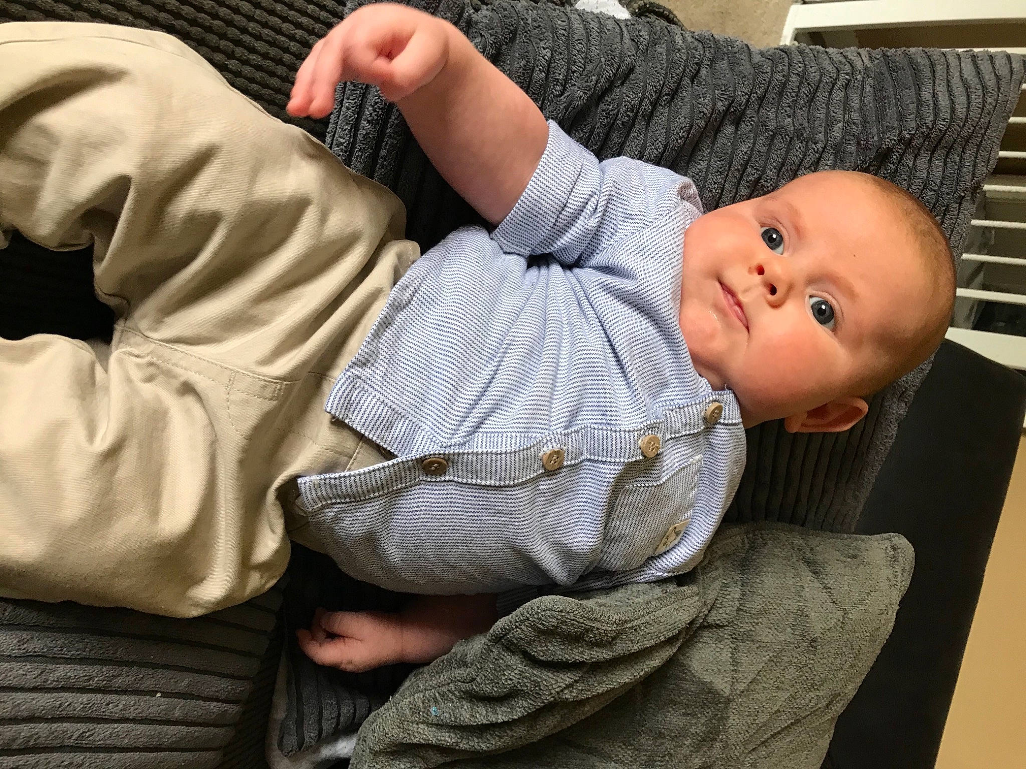 Ellis is registered to the contest to win money with this photo: baby, baby_toddler_clothing, cheek, comfort, dress_shirt, elbow, finger, gesture, human_body, human_leg, joint, knee, mouth, nose, person, product, skin, sleeve, thigh, toddler
