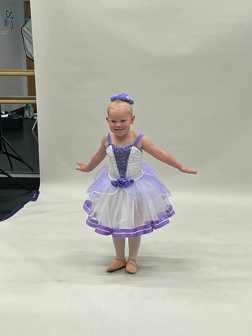 Scarlett is registered to the contest to win money with this photo: art, choreography, dance, dancer, dress, electric_blue, entertainment, event, fashion_design, fun, happy, headgear, human_leg, joy, magenta, performing_arts, person, purple, recreation, smile