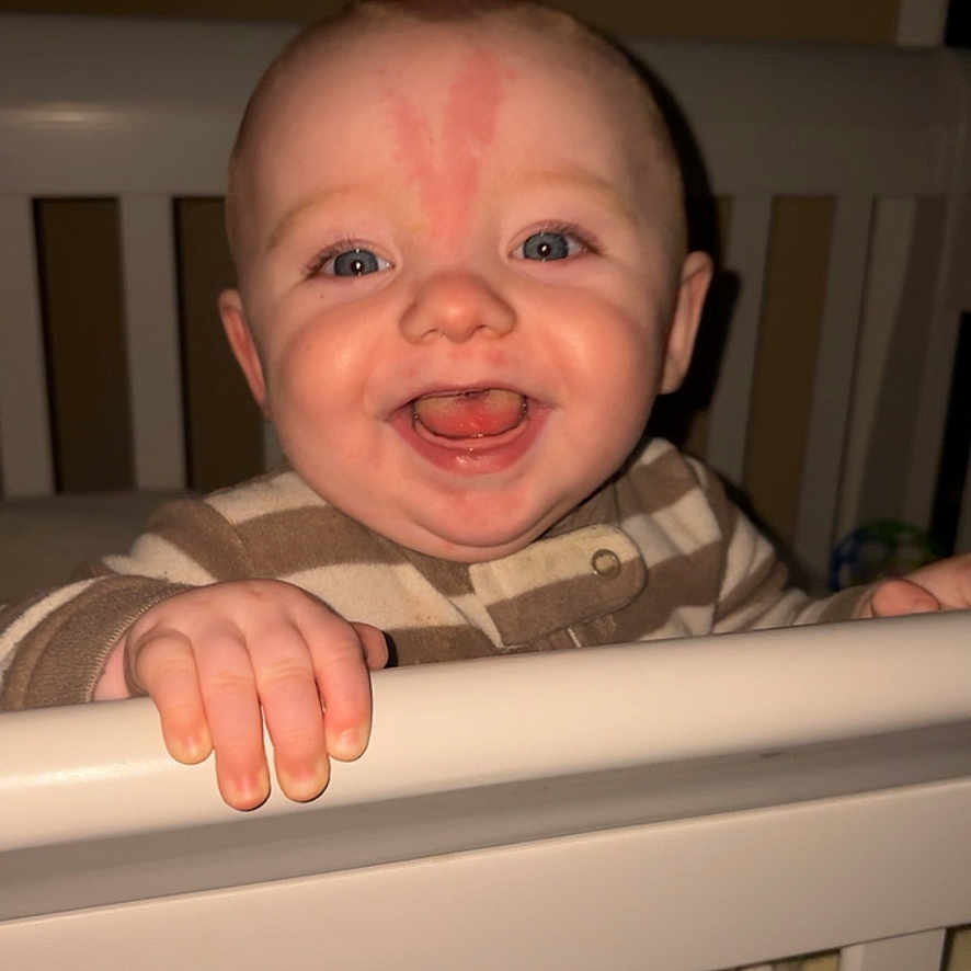 Bentleigh joined the competition — help win amazing prizes! baby, bedroom, blanket, blue_eyes, child, crib, cute, face, furniture, hand, happy, holding, indoor, infant, nursery, person, sleepwear, smile, striped_clothing, toddler