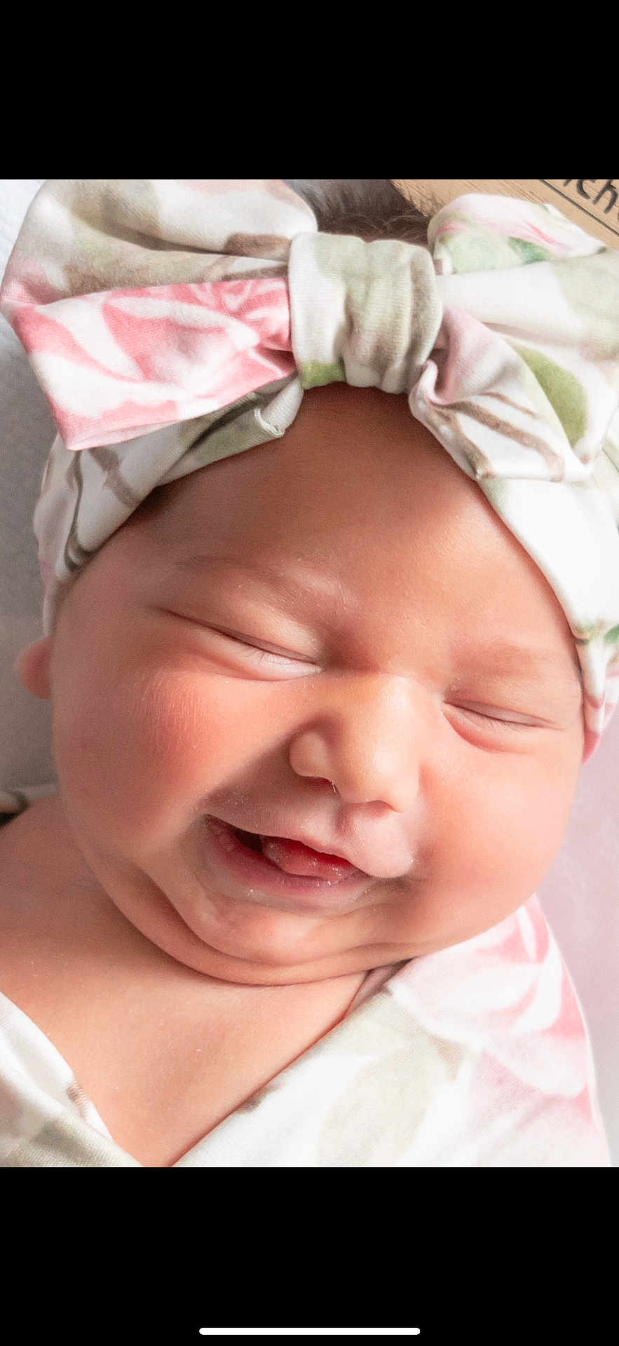 Cassi joined the competition — help win amazing prizes! baby, infant, smiling, face, headwrap, clothing, closeup, newborn, skin, cute, happy, child, portrait, expression, head, babywear, peaceful, soft, adorable, sleepy