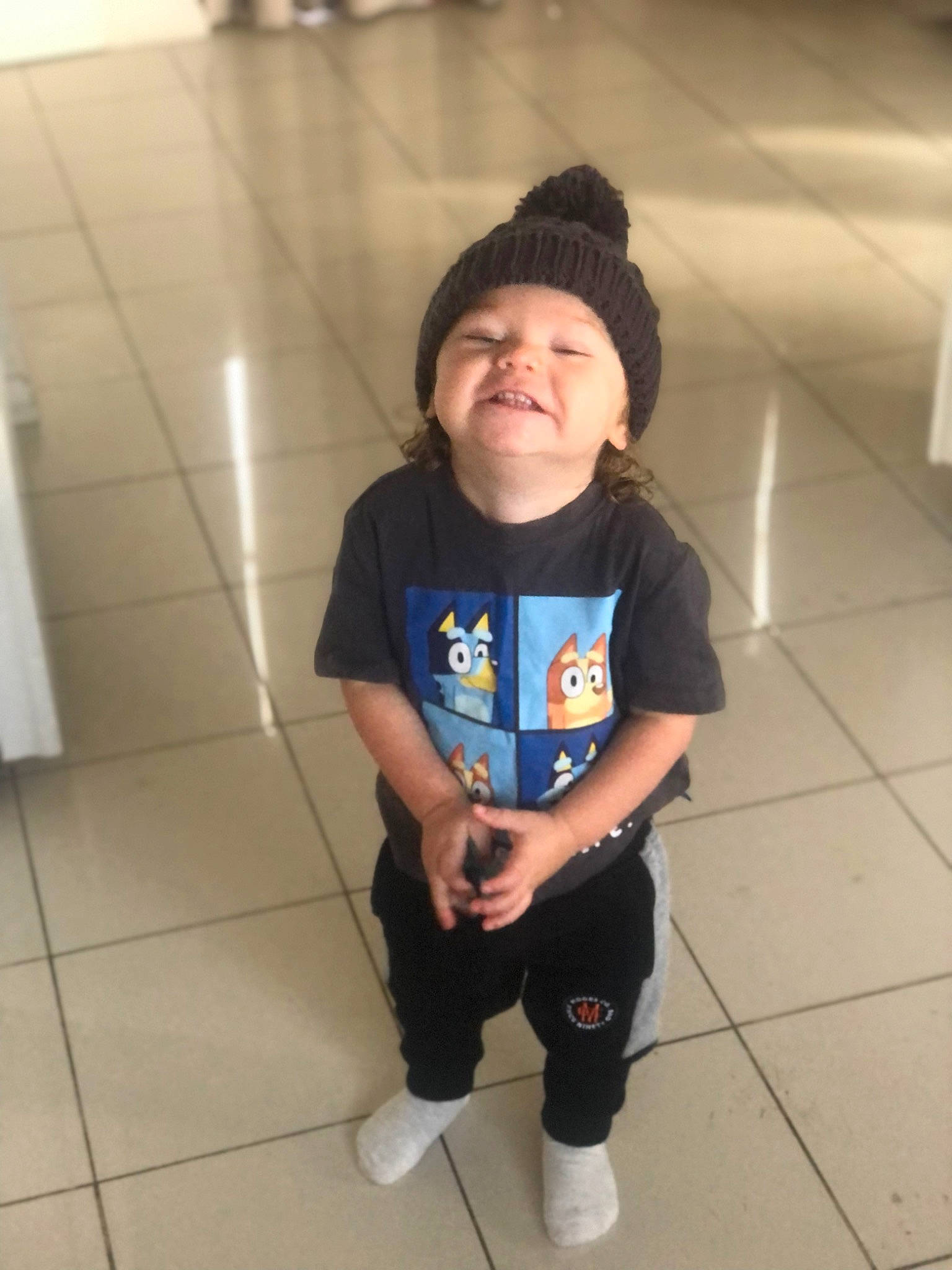 Kohen is registered to the contest to win money with this photo: baby_toddler_clothing, cap, cool, electric_blue, floor, flooring, fun, happy, headwear, human_leg, knee, person, shorts, skin, sleeve, sneakers, sportswear, standing, sweatpant, t_shirt