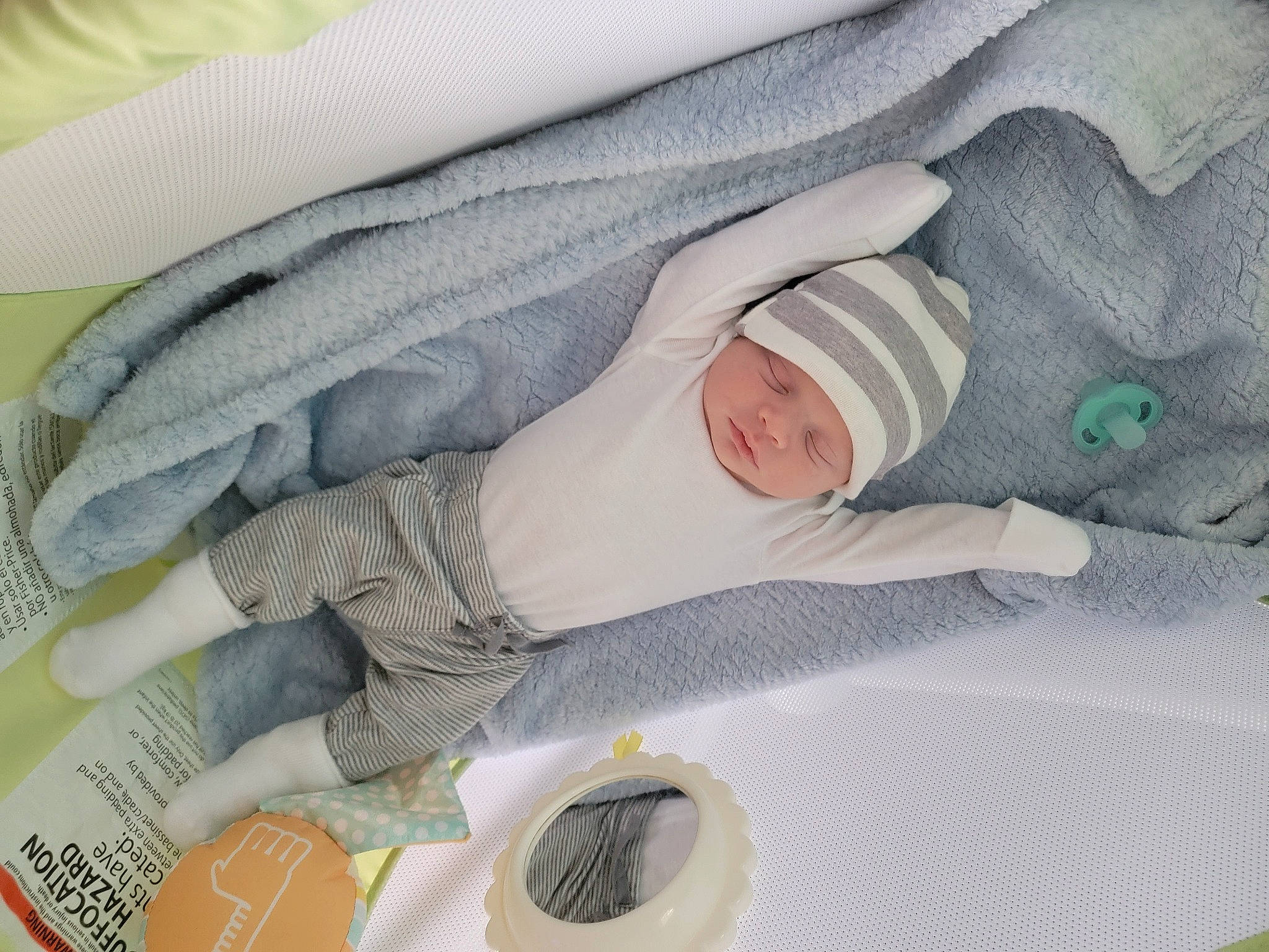 Juwan is registered to the contest to win money with this photo: baby, baby_products, baby_safety, baby_sleeping, baby_toddler_clothing, child, comfort, dishware, hat, headwear, household_supply, linens, nap, pattern, person, room, serveware, sleep, sleeve, tableware