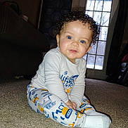 Courage joined the competition — help win amazing prizes! blue_eyes, bright, carpet, child, clothing, couch, curly_hair, cute, floor, home, indoor, long_sleeve, pajamas, person, sitting, smiling, toddler, toy_pattern, window, young_child
