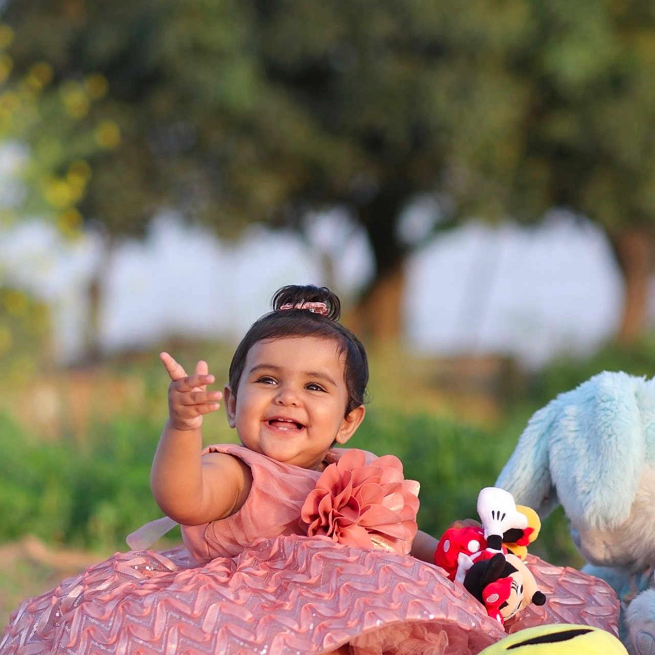 Anoora joined the competition — help win amazing prizes! baby, child, cute, flower, fun, grass, happy, mickey_mouse, minnie_mouse, nature, outdoor, person, pink_dress, playtime, plush_toy, portrait, sitting, smiling, sunlight, toy