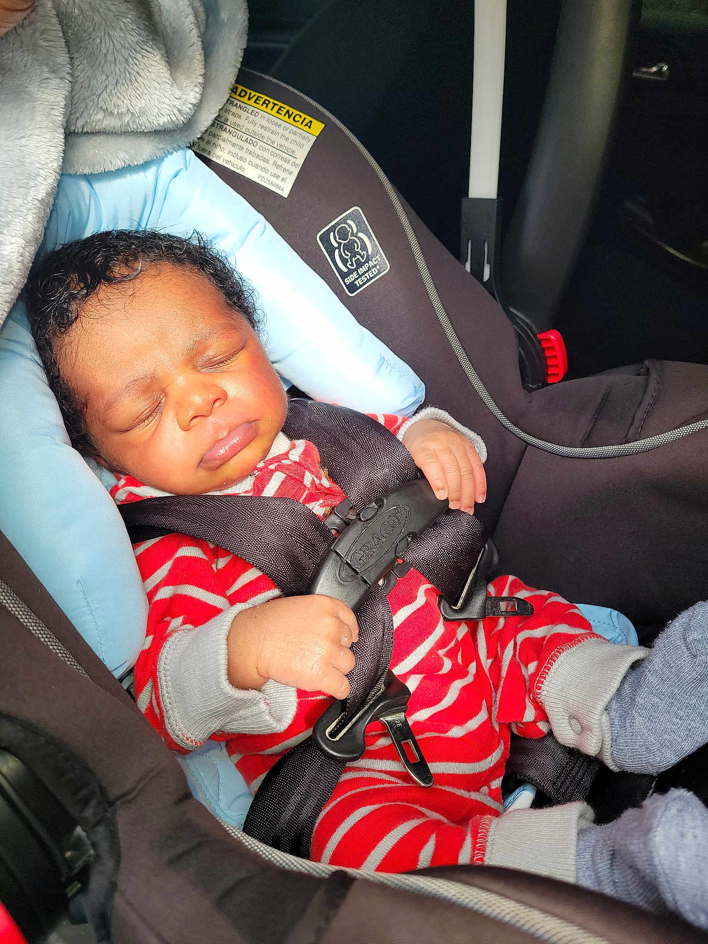 Aeson joined the competition — help win amazing prizes! baby, car_seat, child, infant, sleeping, safety_harness, clothing, stripes, hand, footwear, sock, seat_belt, car_interior, head, face, person, rest, cute, transportation, comfort