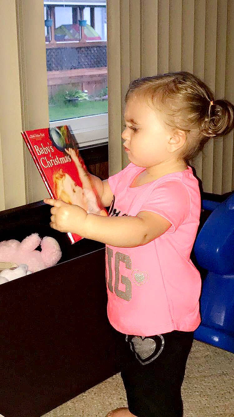 Kylie is registered to the contest to win money with this photo: baby, baby_toddler_clothing, beauty, box, carton, child, comfort_food, finger, fun, hairstyle, joint, nail, packaging_and_labeling, person, pink, play, publication, room, snack, thumb