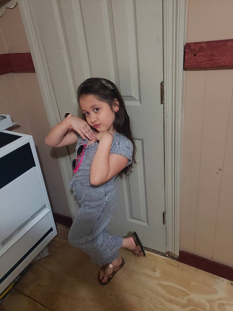 Amelia is registered to the contest to win money with this photo: baby_toddler_clothing, child, door, flooring, foot, fun, hardwood, human_leg, joint, knee, laminate_flooring, pattern, person, shoulder, thigh, toddler, varnish, waist, wood, wood_flooring