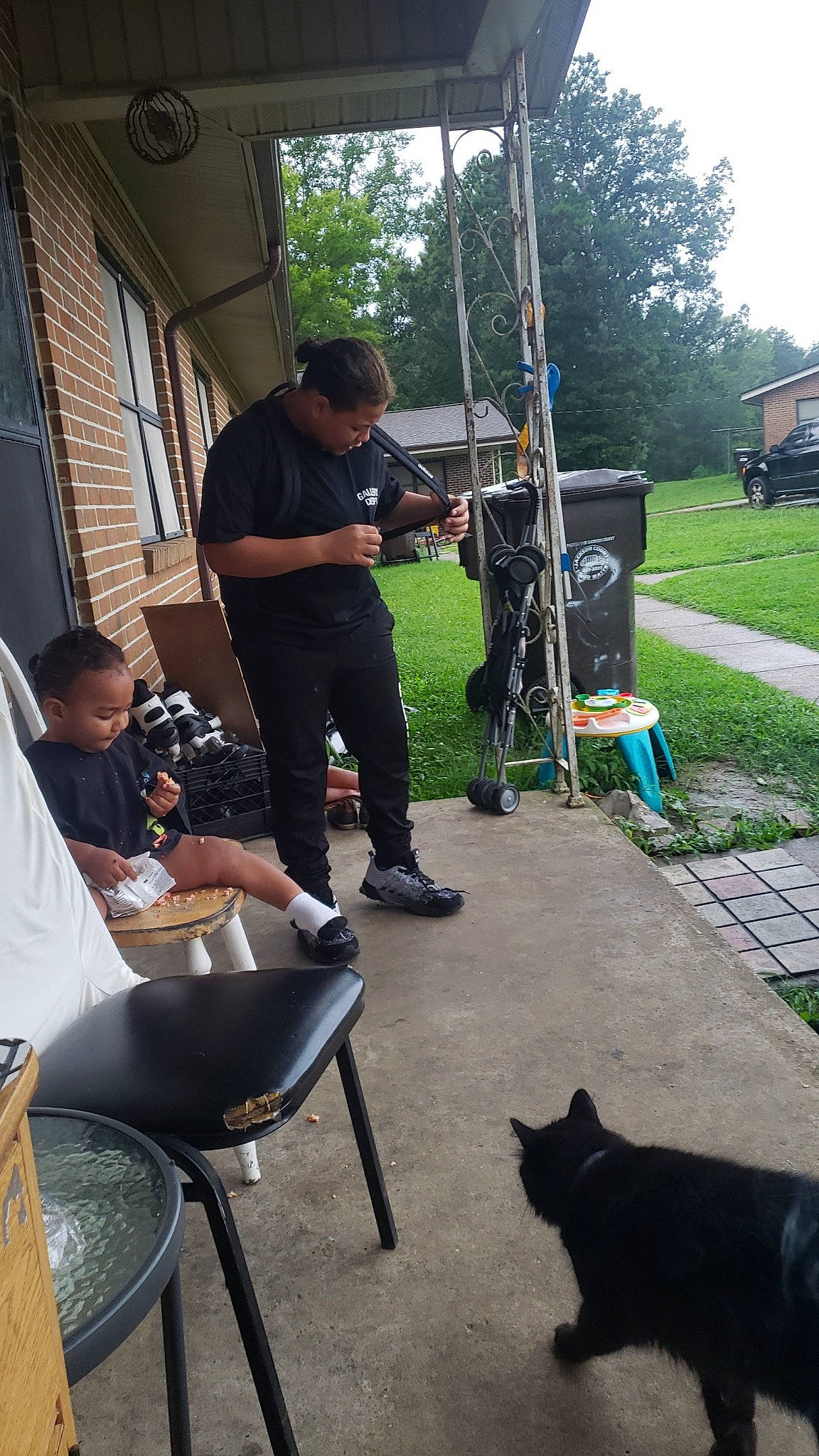 Camrynn is registered to the contest to win money with this photo: automotive_tire, automotive_wheel_system, backpack, chair, dog_breed, event, fun, grass, leisure, metal, person, plant, recreation, sitting, soil, t_shirt, tail, tire, tree, truck