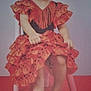 barefoot, chair, child, cute, dress, fashion, flamenco, flower, frills, happy, headband, indoor, person, polka_dot, portrait, red, sitting, smile, toddler, young_child