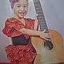 accessory, barefoot, celebration, chair, child, cute, flower, guitar, happy, headband, indoor, music, musical_instrument, performance, polka_dot, portrait, red_dress, sitting, smiling, young