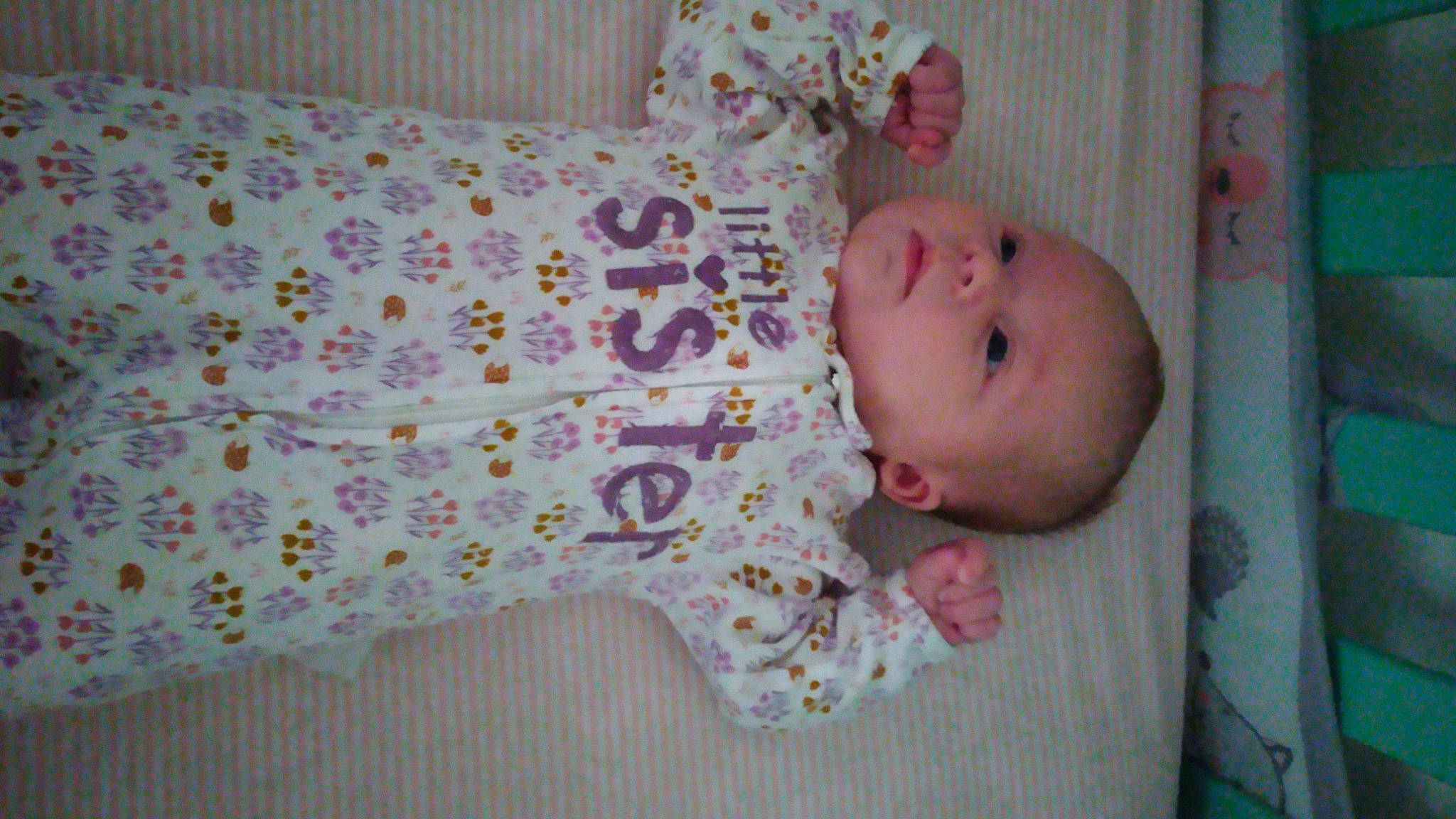 Bridget is registered to the contest to win money with this photo: baby, baby_products, baby_safety, baby_toddler_clothing, baby_toys, cheek, child, eye, head, human_body, linens, nightwear, pattern, person, product, room, skin, sleeve, textile, toddler