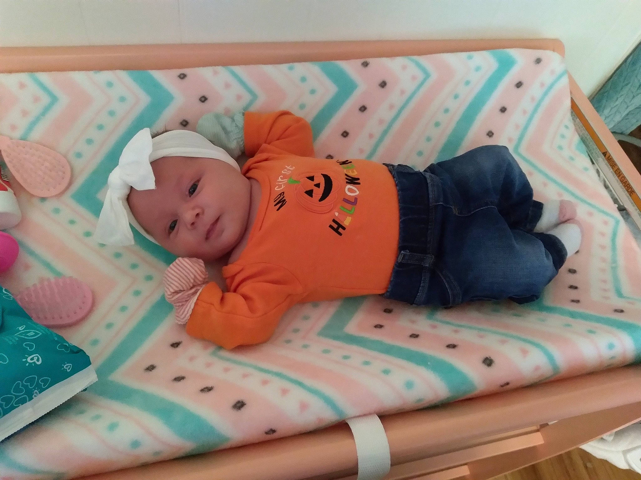 Bridget joined the competition — help win amazing prizes! baby, baby_products, baby_safety, baby_sleeping, baby_toddler_clothing, baby_toys, bedding, child, comfort, couch, hat, headwear, infant_bed, linens, orange, pattern, person, pink, rectangle, room