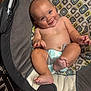 baby, infant, smiling, baby_seat, diaper, bare_chest, chubby, cute, happy, indoors, patterned_fabric, wood_floor, foot, hand, portrait, child, seat_belt, playful, skin, head
