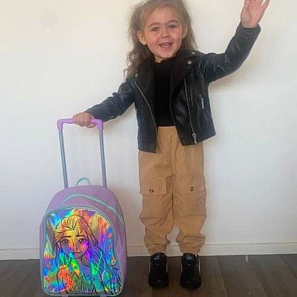 Zélie participe au concours pour gagner de l'argent avec cette photo : baby_toddler_clothing, backpack, bag, child, cleanliness, electric_blue, flooring, fun, gesture, happy, joy, knee, luggage_and_bags, outerwear, paint, person, plastic_bag, sleeve, smile, standing