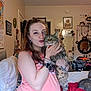 Krueger joined the competition — help win amazing prizes! woman, cat, indoor, bedroom, bed, mirror, tattoo, piercing, clothing, pet, furniture, decorations, portrait, holding, tabby_cat, smile, casual, hair, bracelet, watch
