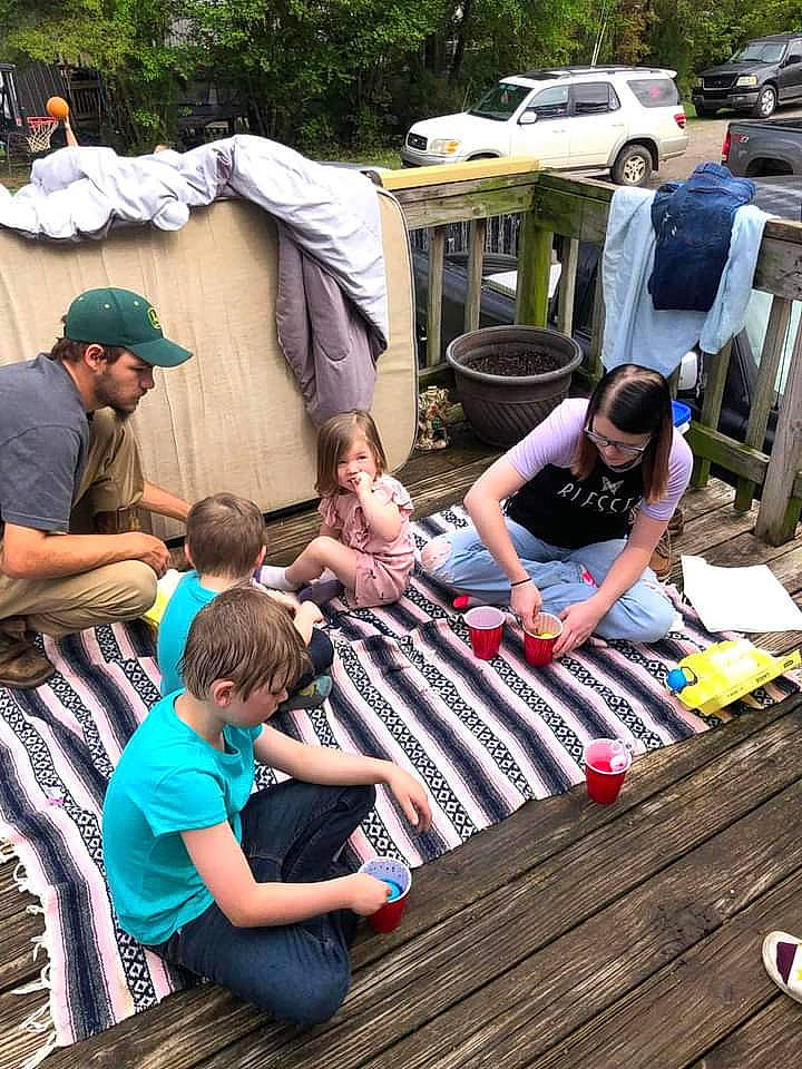 Carmen is registered to the contest to win money with this photo: chair, child, community, event, eyewear, fun, games, headwear, leisure, person, public_space, recreation, sharing, shoe, shorts, sitting, sneakers, style, summer, t_shirt