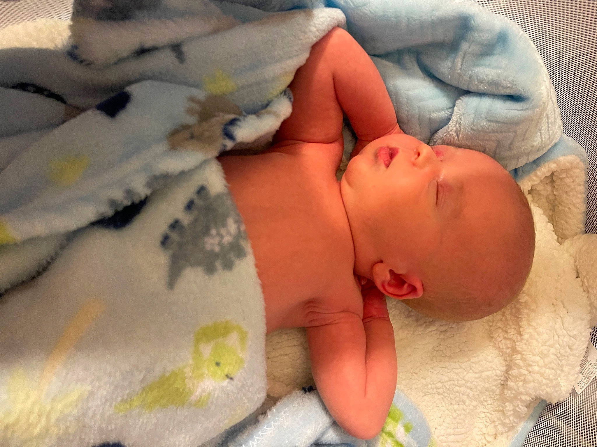 Bryson is registered to the contest to win money with this photo: abdomen, baby, baby_products, baby_sleeping, bed, bed_sheet, bedding, bedtime, blanket, child, comfort, duvet, linens, nap, pattern, person, room, skin, sleep, toddler