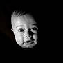 baby, face, portrait, infant, black_background, expression, cute, child, closeup, eyes, mouth, skin, head, newborn, person, young, adorable, innocent, light, shadow