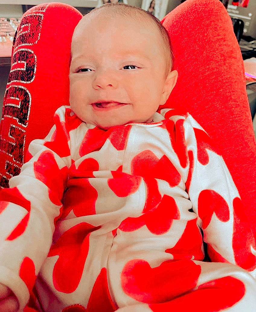 Briella joined the competition — help win amazing prizes! baby, baby_toddler_clothing, cheek, chin, collar, comfort, eye, face, facial_expression, happy, head, joy, lip, neck, person, pink, red, skin, sleeve, smile