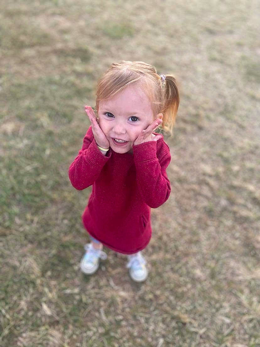 Dahlia joined the competition — help win amazing prizes! baby, baby_toddler_clothing, child, eye, fun, gesture, grass, hand, happy, leisure, magenta, people_in_nature, person, plant, recreation, smile, soil, thumb, toddler, tree
