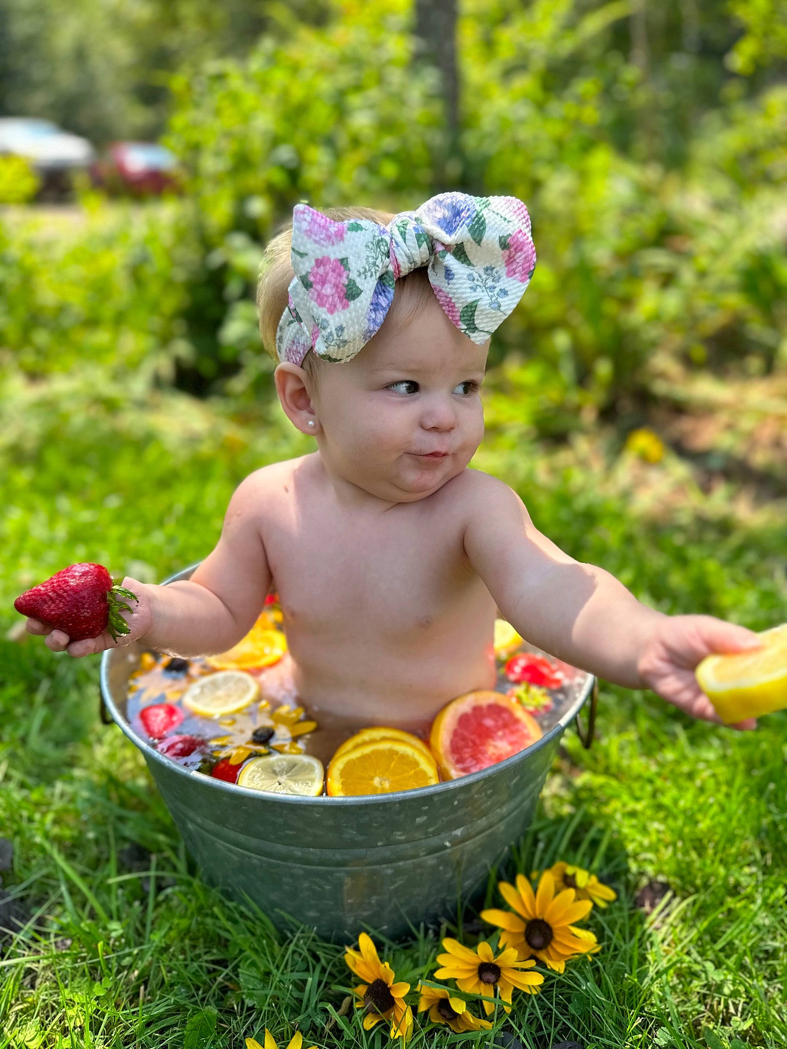 Geneva joined the competition — help win amazing prizes! baby, baby_products, baby_toddler_clothing, child, eye, face, flower, fun, garden, grass, happy, head, headwear, leisure, people_in_nature, person, picnic, plant, recreation, sitting