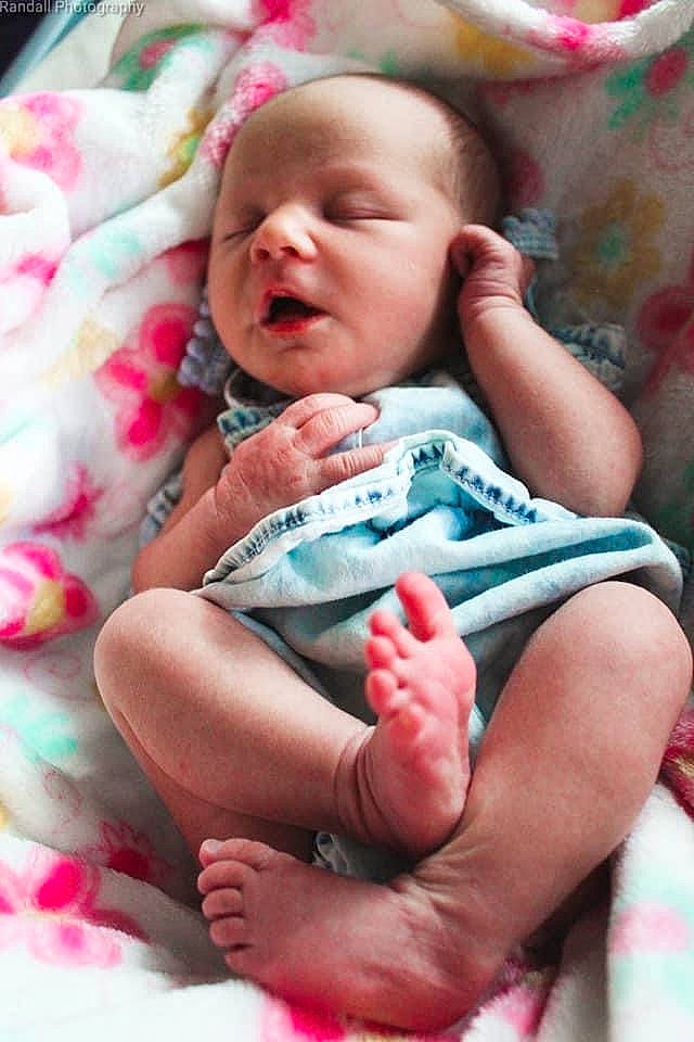 Paisley is registered to the contest to win money with this photo: baby, baby_products, baby_toddler_clothing, cheek, child, comfort, finger, green, hand, happy, head, linens, mouth, person, pink, red, sitting, skin, textile, thumb