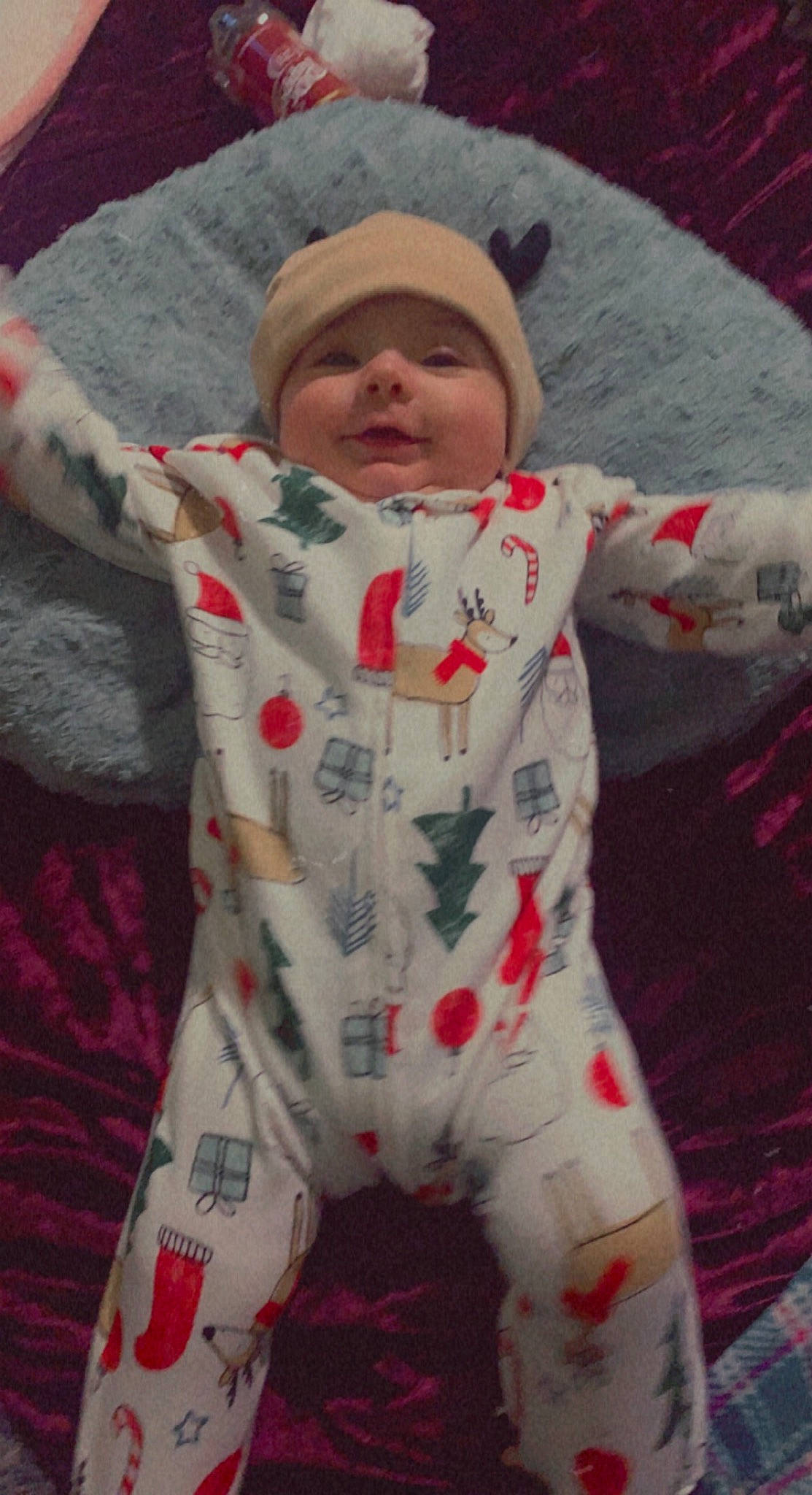 Ariella is registered to the contest to win money with this photo: baby, baby_toddler_clothing, carmine, child, comfort, eye, face, fun, happy, headwear, linens, nightwear, pattern, person, skin, sleeve, textile, thumb, toddler