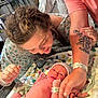 newborn, baby, hospital, parents, mother, father, baby_hat, diaper, blanket, hospital_gown, tattoo, hospital_bracelet, family, love, medical_equipment, infant, skin_to_skin, happy, indoor, care
