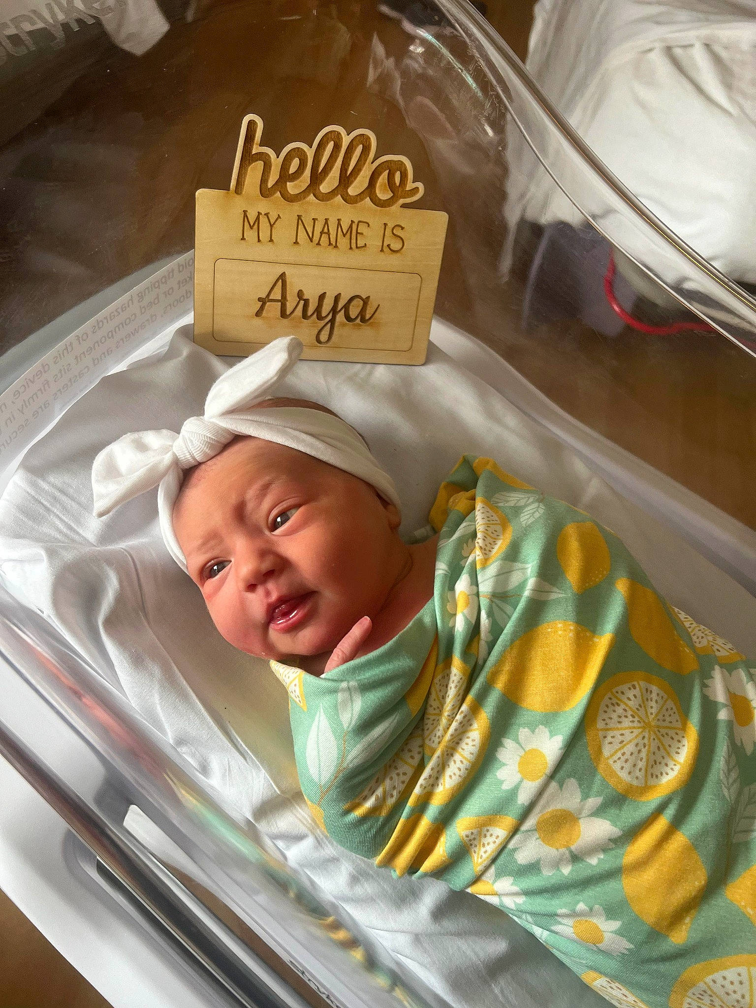 Arya is registered to the contest to win money with this photo: automotive_lighting, baby, baby_products, baby_safety, baby_toddler_clothing, bedding, box, child, comfort, comfort_food, event, font, hat, headwear, infant_bed, linens, person, personal_luxury_car, sleep, smile