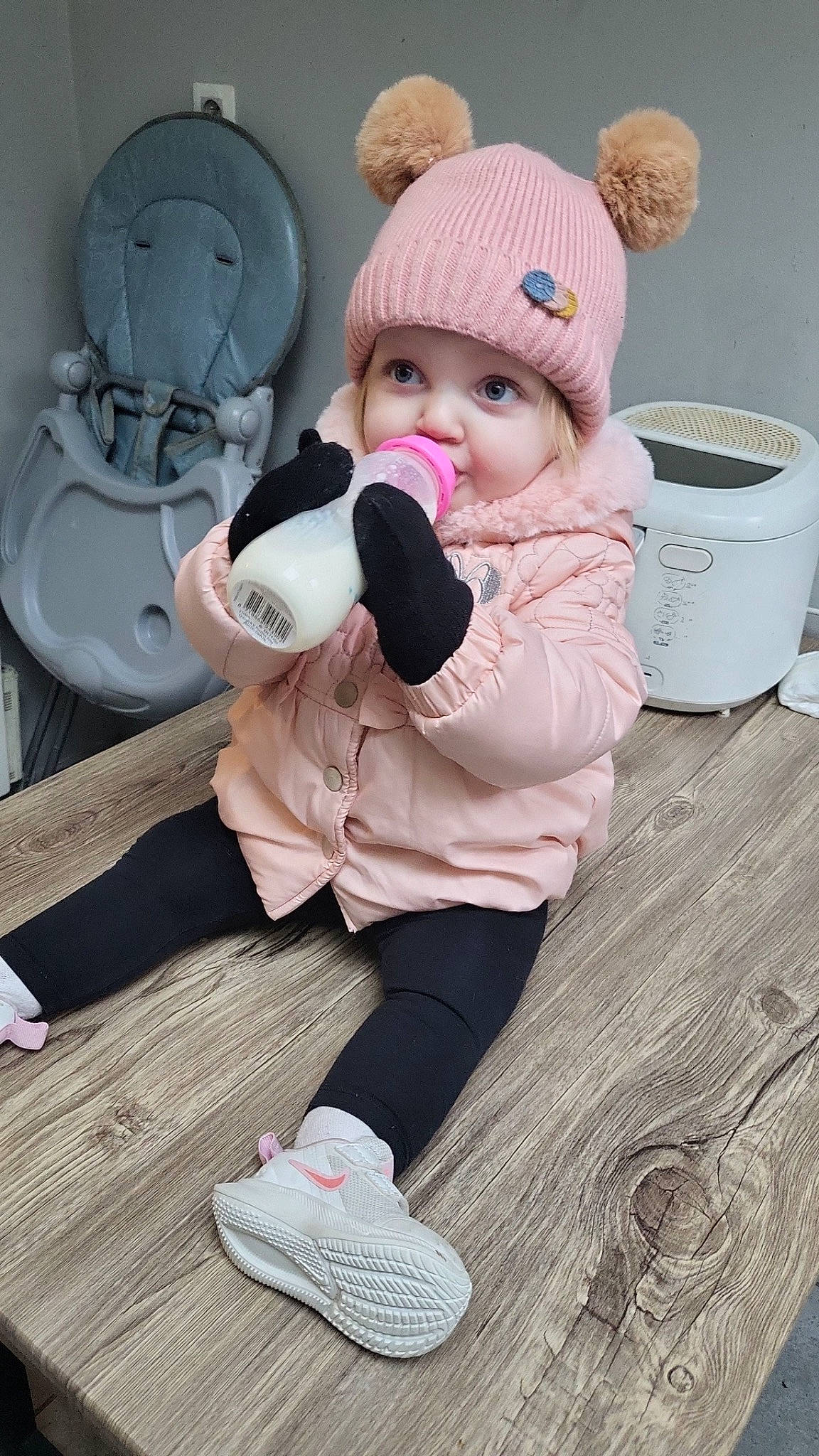 Nelya participe au concours pour gagner de l'argent avec cette photo : audio_equipment, baby, baby_toddler_clothing, cap, child, comfort, flooring, fur, happy, headwear, person, pink, plush, shoe, sitting, sneakers, stuffed_toy, textile, toddler, toy