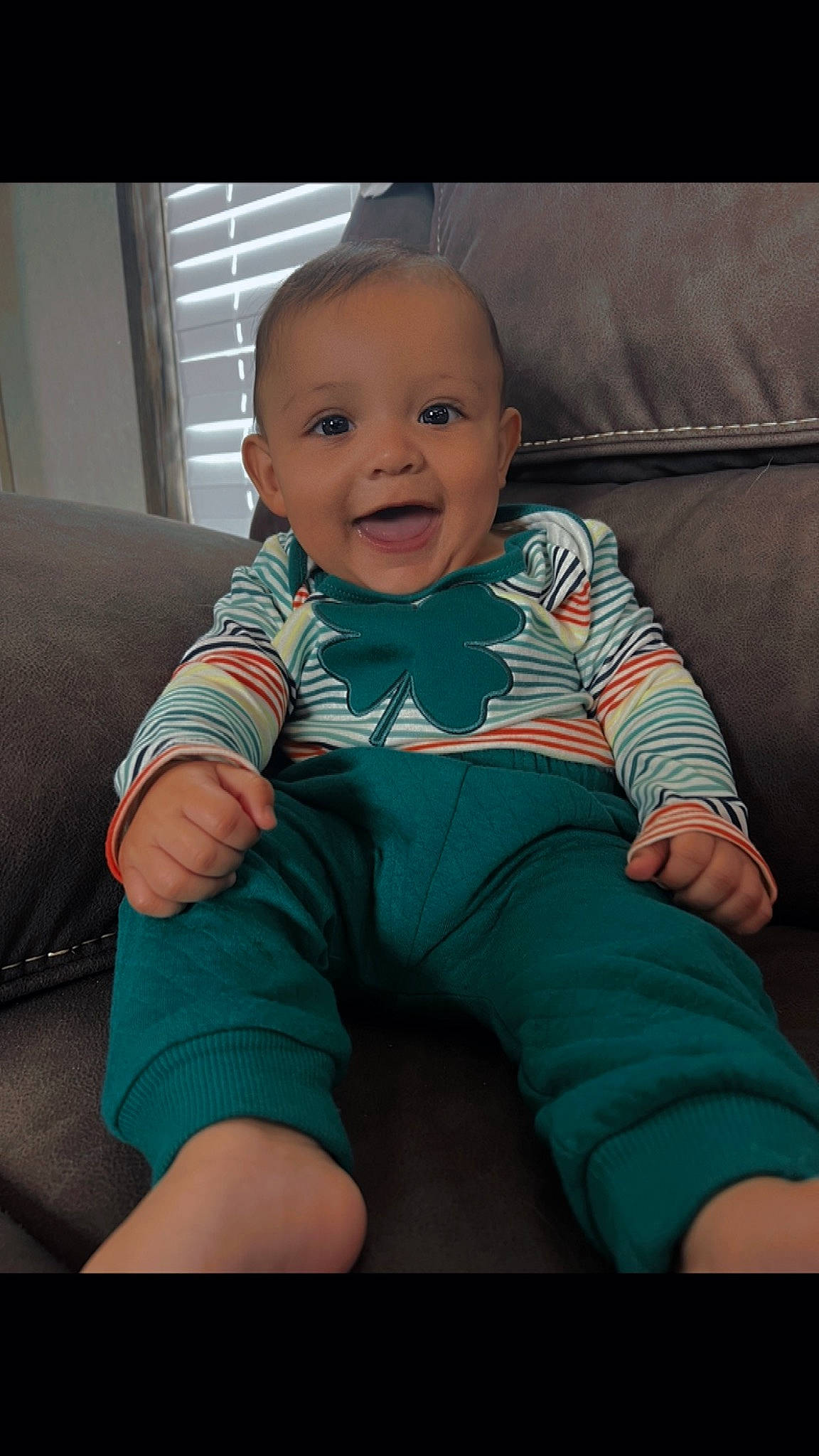 Isaias joined the competition — help win amazing prizes! baby, baby_toddler_clothing, cheek, child, comfort, couch, elbow, electric_blue, finger, flash_photography, happy, human_leg, joy, knee, person, sitting, skin, sleeve, smile, t_shirt