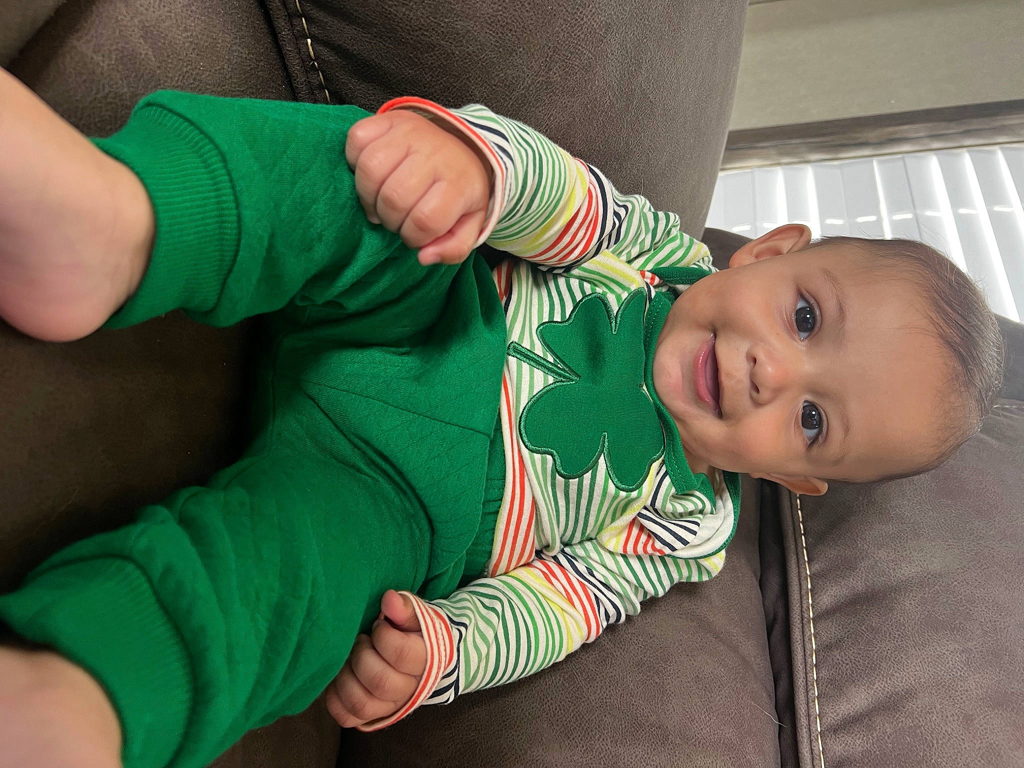 Isaias is registered to the contest to win money with this photo: baby, baby_toddler_clothing, child, comfort, elbow, finger, gesture, hand, happy, human_body, joy, knee, leg, nose, person, skin, sleeve, smile, sock, thigh