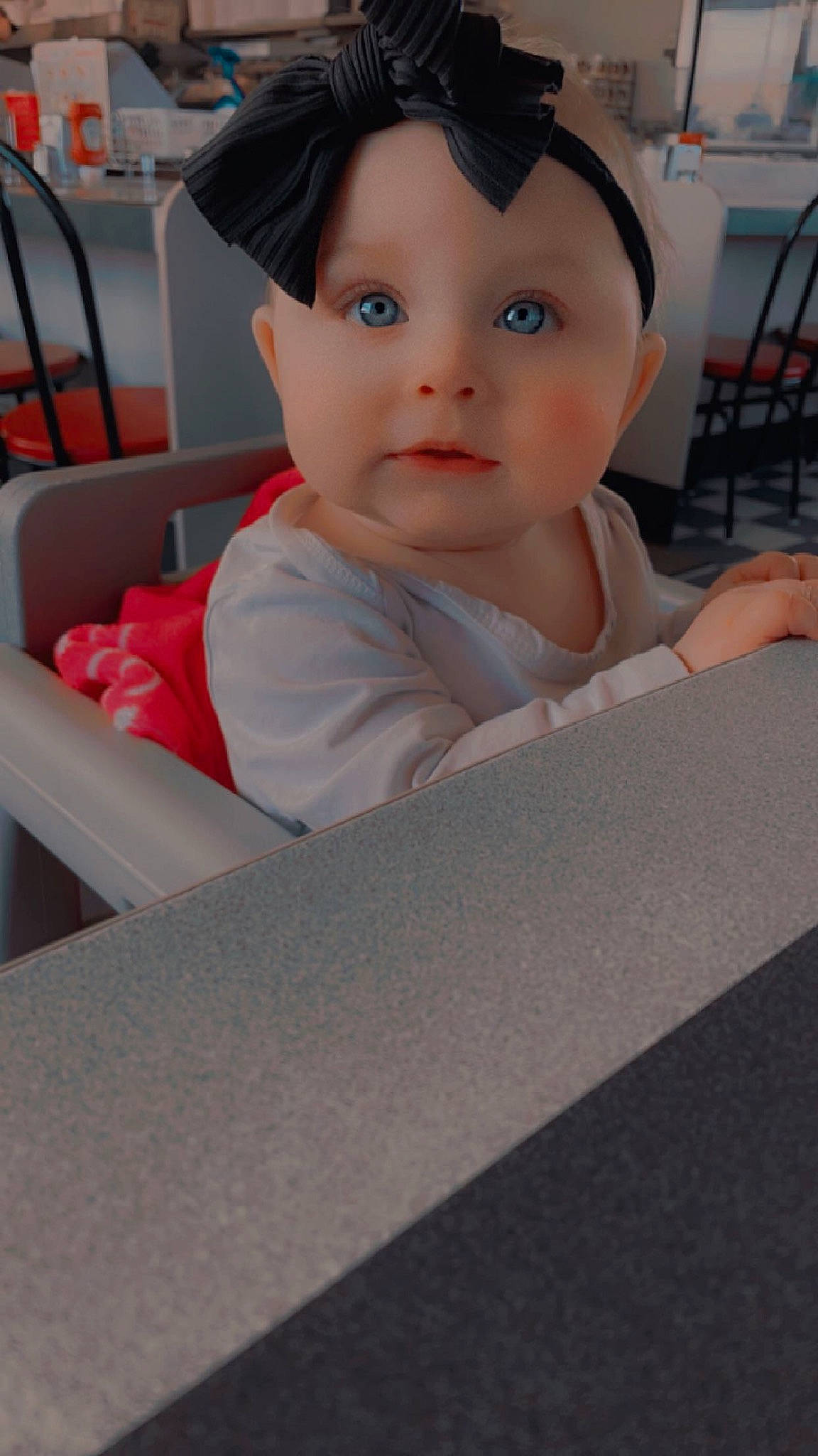 Kinsley is registered to the contest to win money with this photo: auto_part, automotive_wheel_system, baby, baby_products, baby_toddler_clothing, cap, carmine, cheek, child, chin, comfort, eyelash, fashion_accessory, fun, hairstyle, hat, mammal, person, sitting, sleeve